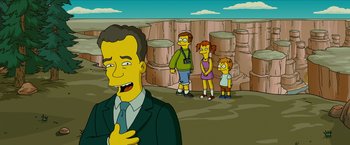 Movie still from “The Simpsons Movie” (2007), directed by David Silverman – A man and two children standing next to each other in front of a cliff; Medium shot, High angle