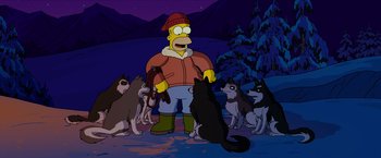 Movie still from “The Simpsons Movie” (2007), directed by David Silverman – A man standing next to a group of dogs; Wide shot, High angle