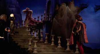 Movie still from “Fitzcarraldo” (1982), directed by Werner Herzog – A scene of a scene with a person on a stage; Wide shot, High angle