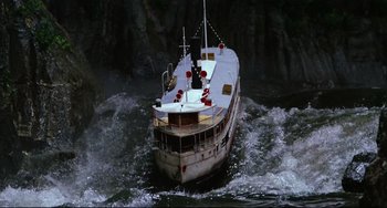 Movie still from “Fitzcarraldo” (1982), directed by Werner Herzog – A large boat in the middle of the water; Extreme Wide shot, High angle