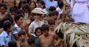 Movie still from “Fitzcarraldo” (1982), directed by Werner Herzog – A group of people standing next to each other in a crowd; Medium shot, High angle