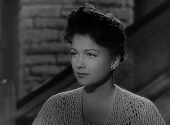 Movie still from “Five Graves to Cairo” (1943), directed by Billy Wilder – A black - and - white photo of a woman in a sweater; Close Up shot, High angle