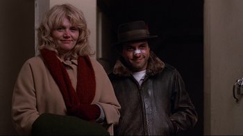 Movie still from “Flashdance” (1983), directed by Adrian Lyne – A man and a woman standing next to each other; Close Up shot, Low angle