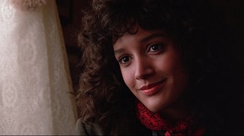 Movie still from “Flashdance” (1983), directed by Adrian Lyne – A person wearing a red scarf; Close Up shot, Low angle