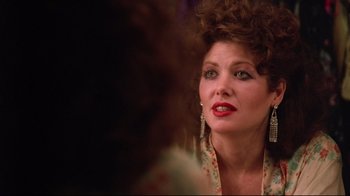 Movie still from “Flashdance” (1983), directed by Adrian Lyne – A person wearing a dress; Close Up shot, Over the shoulder angle