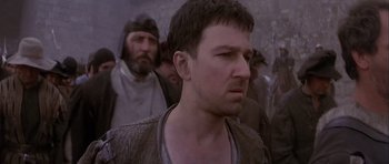 Movie still from “Flesh+Blood” (1985), directed by Paul Verhoeven – A person with a beard; Close Up shot, Low angle