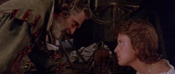 Movie still from “Flesh+Blood” (1985), directed by Paul Verhoeven – A man and a boy looking at each other; Close Up shot, Over the shoulder angle