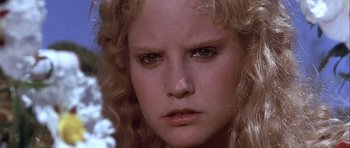 Movie still from “Flesh+Blood” (1985), directed by Paul Verhoeven – A woman's face with a frowning look; Close Up shot, Low angle