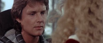 Movie still from “Flesh+Blood” (1985), directed by Paul Verhoeven – A person looking at another person; Close Up shot, Over the shoulder angle