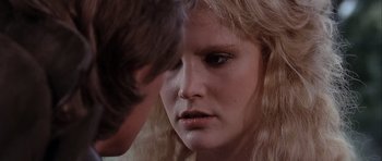Movie still from “Flesh+Blood” (1985), directed by Paul Verhoeven – A man and a woman looking at one another; Close Up shot, Over the shoulder angle
