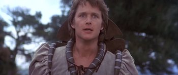 Movie still from “Flesh+Blood” (1985), directed by Paul Verhoeven – A young man in a costume looking to his left; Close Up shot, Low angle