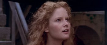 Movie still from “Flesh+Blood” (1985), directed by Paul Verhoeven – A person with long hair; Close Up shot, Low angle