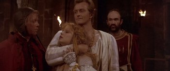 Movie still from “Flesh+Blood” (1985), directed by Paul Verhoeven – A man and a woman dressed in medieval clothing; Close Up shot, Low angle