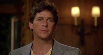 Movie still from “Fletch” (1985), directed by Michael Ritchie – A person wearing a jacket; Close Up shot, Low angle