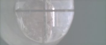 Movie still from “Flickering Lights” (2000), directed by Anders Thomas Jensen – A man looking out a window at the light; Extreme Close Up shot, Overhead angle
