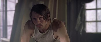 Movie still from “Flickering Lights” (2000), directed by Anders Thomas Jensen – A person with long hair; Close Up shot, Low angle