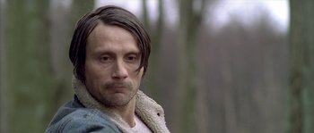 Movie still from “Flickering Lights” (2000), directed by Anders Thomas Jensen – A person wearing a jacket; Close Up shot, Low angle