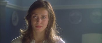 Movie still from “Flickering Lights” (2000), directed by Anders Thomas Jensen – A person with long brown hair; Close Up shot, Over the shoulder angle