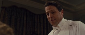 Movie still from “Florence Foster Jenkins” (2016), directed by Stephen Frears – A person wearing a white shirt; Close Up shot, Low angle
