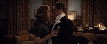 Movie still from “Florence Foster Jenkins” (2016), directed by Stephen Frears – A man and a woman in formal wear standing next to each other; Medium shot, Low angle