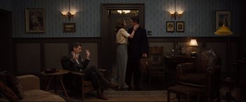 Movie still from “Florence Foster Jenkins” (2016), directed by Stephen Frears – A man and a woman standing next to each other in a room; Wide shot, Over the shoulder angle