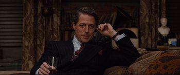 Movie still from “Florence Foster Jenkins” (2016), directed by Stephen Frears – A person wearing a suit and tie; Close Up shot, Over the shoulder angle