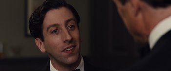 Movie still from “Florence Foster Jenkins” (2016), directed by Stephen Frears – A person wearing a suit and a bow tie; Close Up shot, Over the shoulder angle