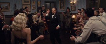 Movie still from “Florence Foster Jenkins” (2016), directed by Stephen Frears – A group of people dancing in a room; Wide shot, High angle
