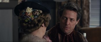 Movie still from “Florence Foster Jenkins” (2016), directed by Stephen Frears – A man and a woman looking at one another; Close Up shot, Over the shoulder angle
