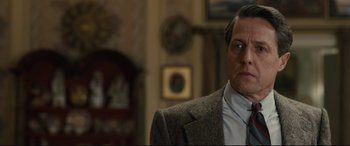 Movie still from “Florence Foster Jenkins” (2016), directed by Stephen Frears – A person wearing a suit and tie; Close Up shot, Over the shoulder angle