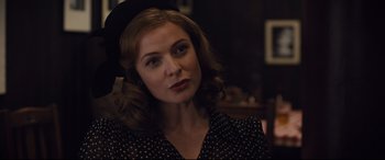 Movie still from “Florence Foster Jenkins” (2016), directed by Stephen Frears – A woman in a polka dot dress and a black hat; Close Up shot, Over the shoulder angle