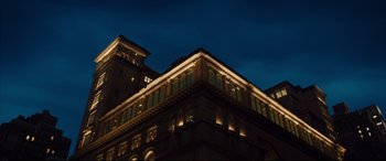 Movie still from “Florence Foster Jenkins” (2016), directed by Stephen Frears – A large building with lights on the top of the building; Extreme Wide shot, Low angle