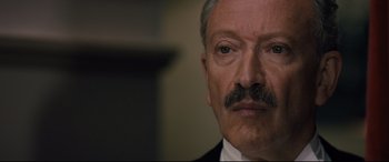 Movie still from “Florence Foster Jenkins” (2016), directed by Stephen Frears – An older man with a mustache wearing a suit and tie; Close Up shot, Low angle