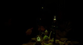 Movie still from “Flowers of Shanghai” (1998), directed by Hsiao-Hsien Hou – A person pointing at a tea pot on the table; Medium shot, Over the shoulder angle