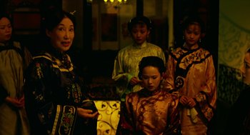 Movie still from “Flowers of Shanghai” (1998), directed by Hsiao-Hsien Hou – A group of women standing next to each other; Medium shot, Over the shoulder angle
