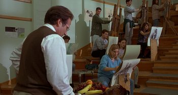 Movie still from “Flubber” (1997), directed by Les Mayfield – A group of people sitting and standing in a room; Wide shot, High angle