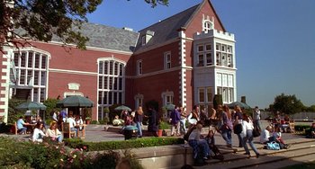 Movie still from “Flubber” (1997), directed by Les Mayfield – A group of people standing outside of a large building; Extreme Wide shot, High angle