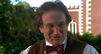 Movie still from “Flubber” (1997), directed by Les Mayfield – A person wearing glasses and a bow tie; Close Up shot, Over the shoulder angle