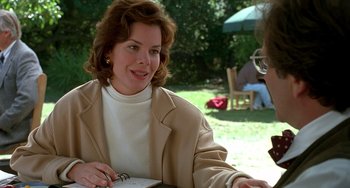 Movie still from “Flubber” (1997), directed by Les Mayfield – A woman sitting at a table with another woman; Medium shot, Over the shoulder angle