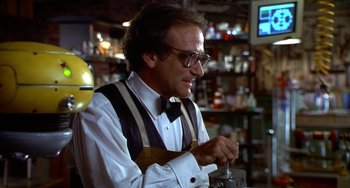 Movie still from “Flubber” (1997), directed by Les Mayfield – A man in a white shirt and a bow tie; Medium shot, Low angle