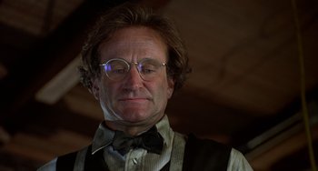 Movie still from “Flubber” (1997), directed by Les Mayfield – An older man wearing glasses and a bow tie; Close Up shot, Low angle