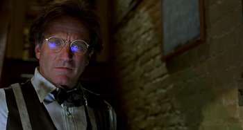 Movie still from “Flubber” (1997), directed by Les Mayfield – An older man wearing glasses and a bow tie; Close Up shot, Low angle