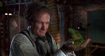 Movie still from “Flubber” (1997), directed by Les Mayfield – An old man holding a green object in his hand; Close Up shot, Over the shoulder angle