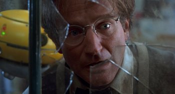 Movie still from “Flubber” (1997), directed by Les Mayfield – A person wearing glasses; Close Up shot, Low angle