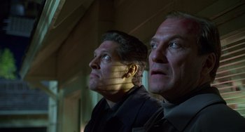 Movie still from “Flubber” (1997), directed by Les Mayfield – A couple of men standing next to each other; Close Up shot, Low angle