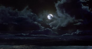 Movie still from “Flubber” (1997), directed by Les Mayfield – A full moon is seen in the night sky; Extreme Wide shot, High angle