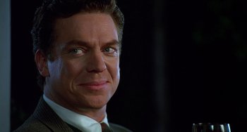 Movie still from “Flubber” (1997), directed by Les Mayfield – A person wearing a suit and tie; Close Up shot, Low angle