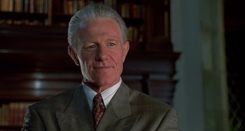 Movie still from “Flubber” (1997), directed by Les Mayfield – An older man wearing a suit and tie; Close Up shot, Low angle