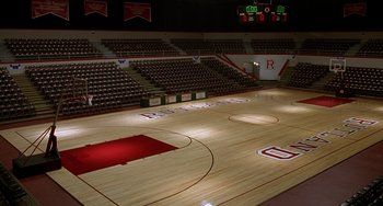 Movie still from “Flubber” (1997), directed by Les Mayfield – An indoor basketball court with a wooden floor; Extreme Wide shot, High angle
