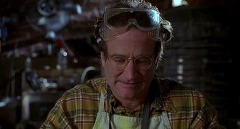 Movie still from “Flubber” (1997), directed by Les Mayfield – A man wearing goggles and an apron; Close Up shot, Low angle